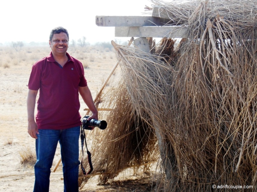 Achal at the cramped straw shelter in DNP, Jaisalmer